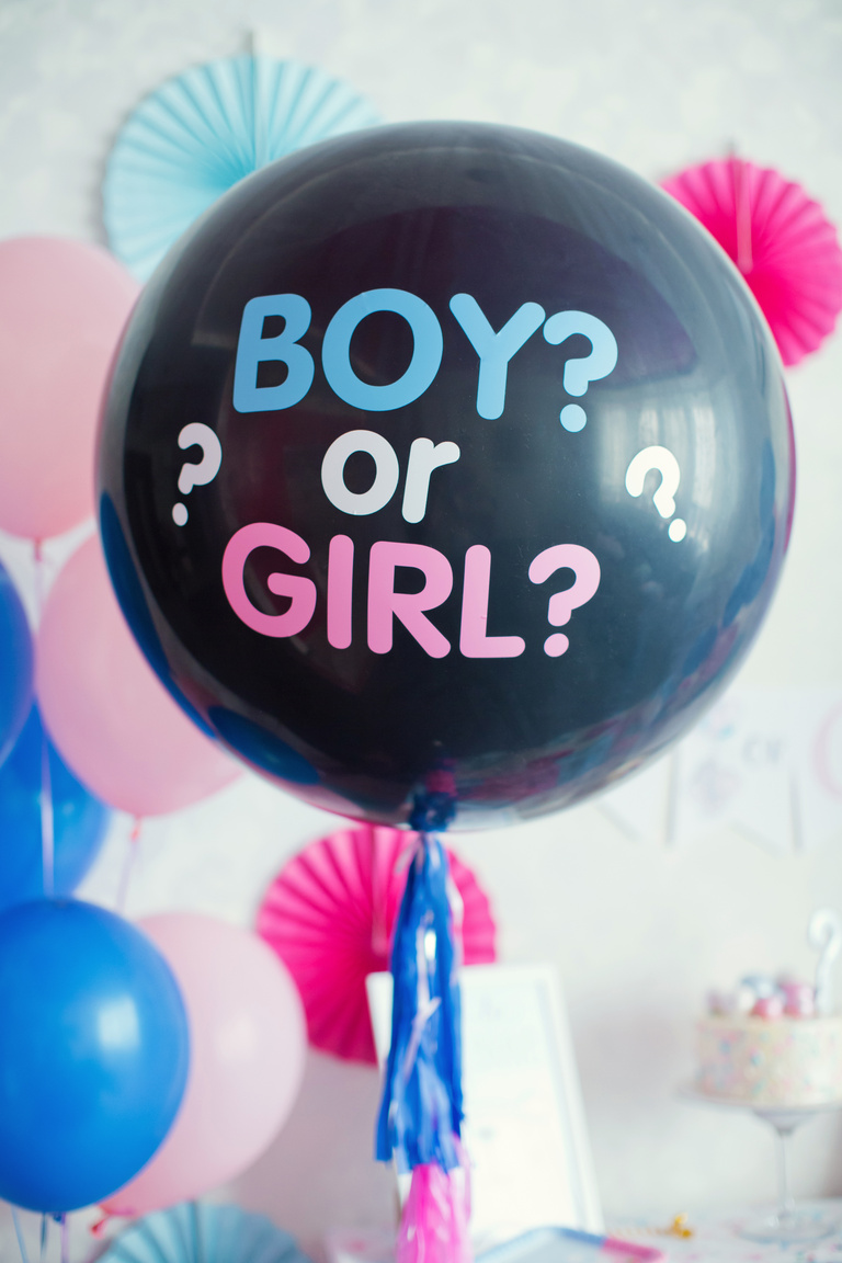 black balloon with "boy or girl?" on gender reveal party
